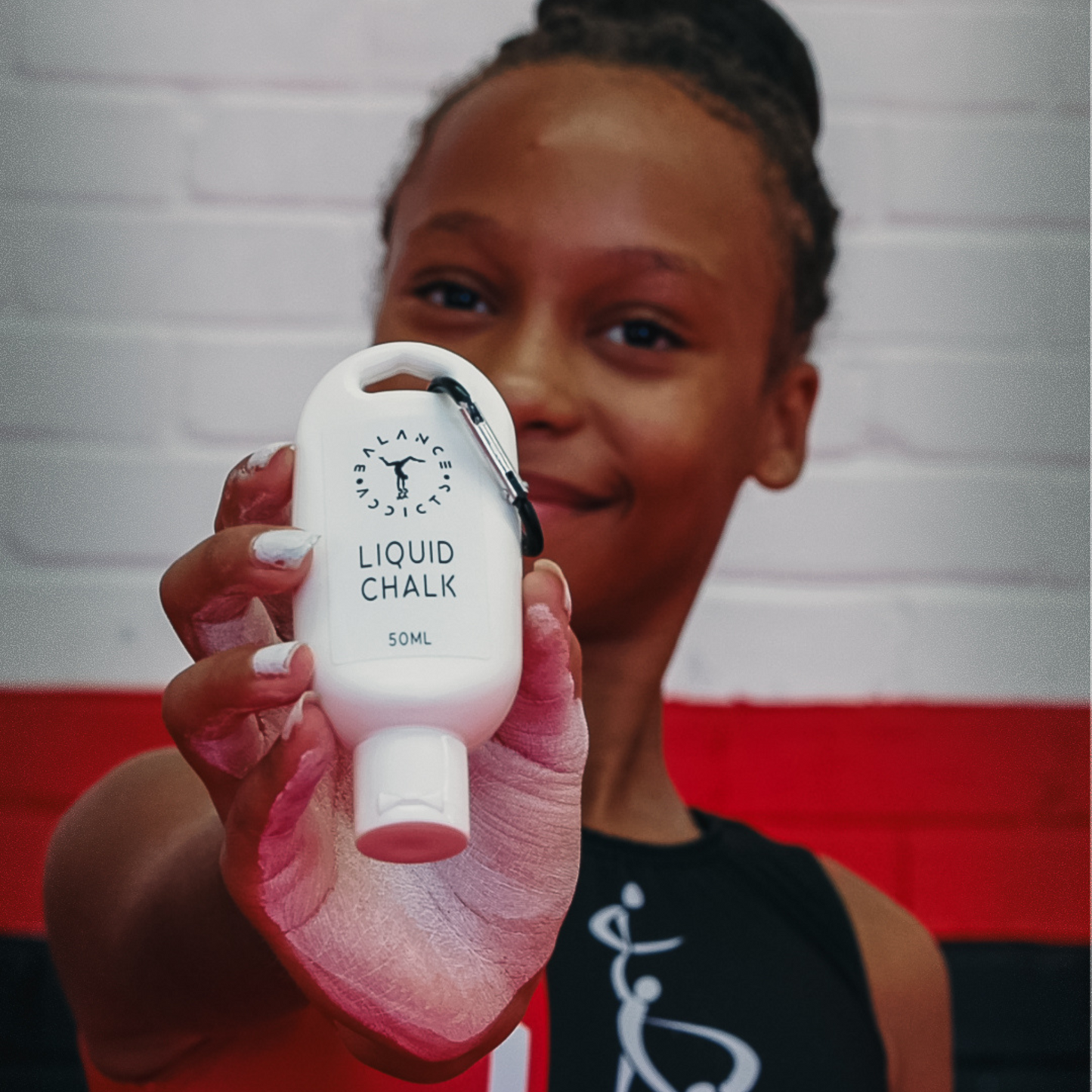 50ml liquid chalk held by acro gymnast