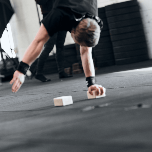 one arm handstand on handstand blocks