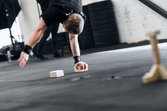 one arm handstand on handstand blocks