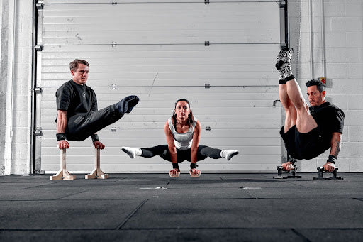 3 gymnasts doing stunts