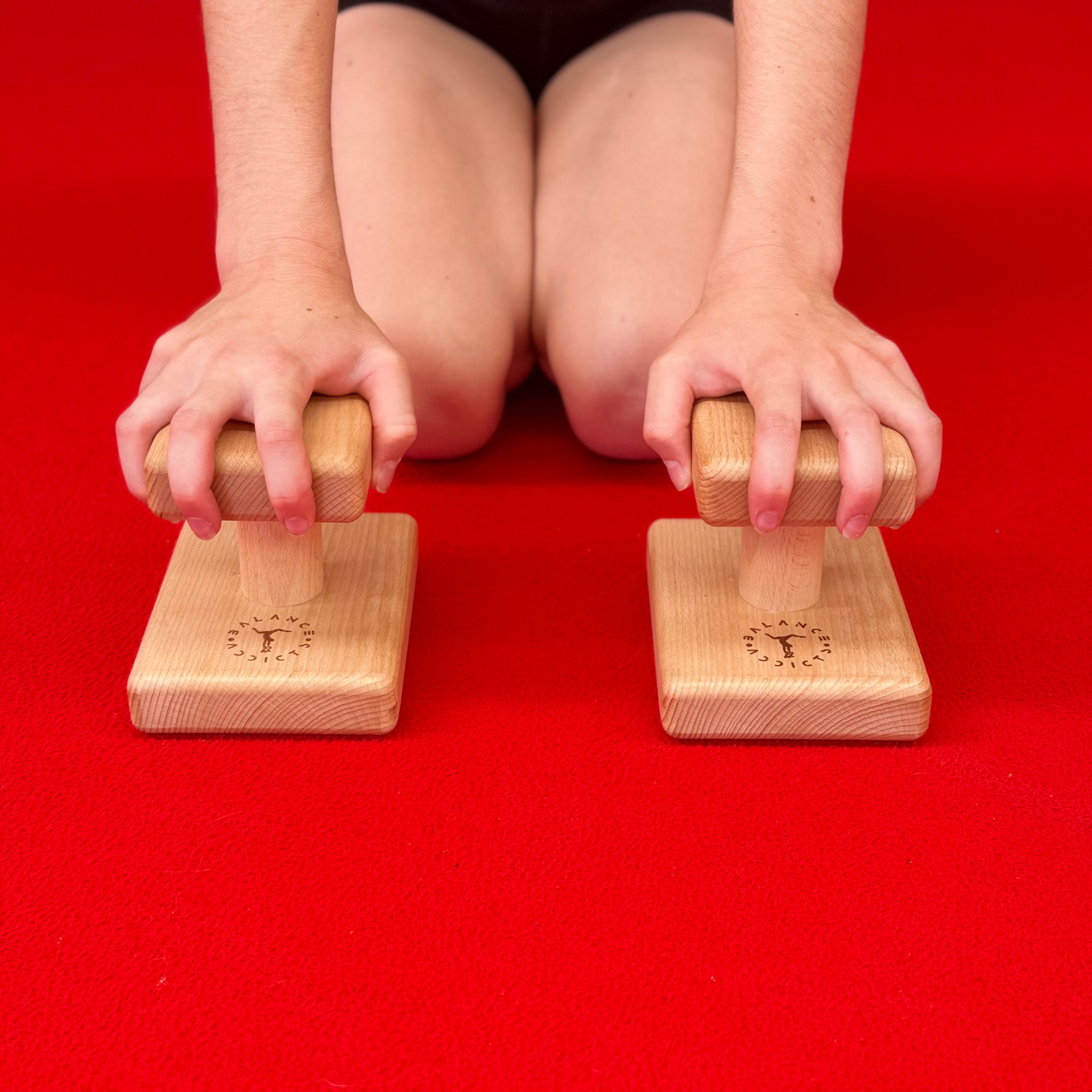 gymnast holding mini handstand canes