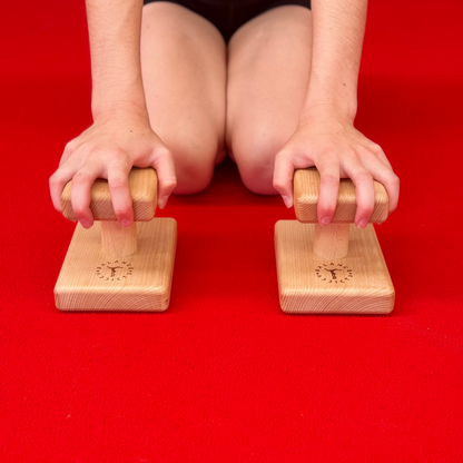 gymnast holding mini handstand canes